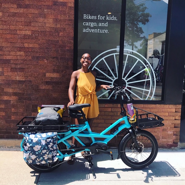 Courtney Cobbs with her new electric cargo bike at Cyclery.