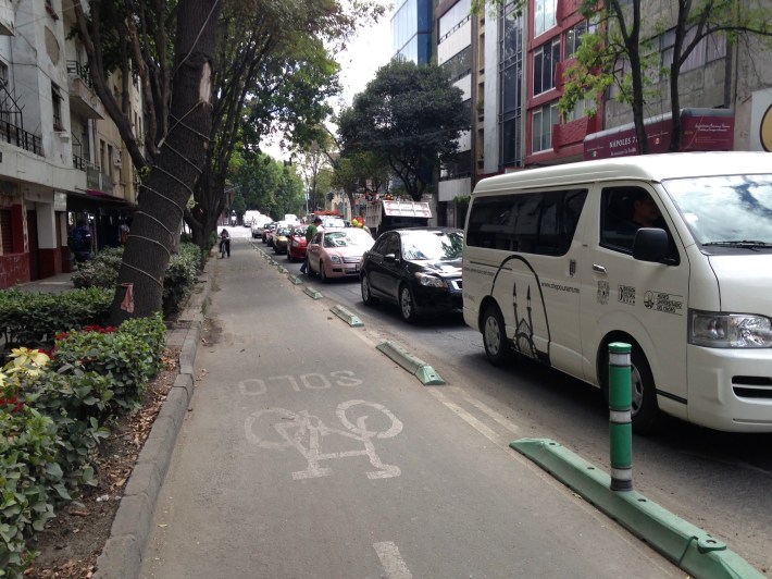A plastic curb-protected bike lane in Mexico City. Photo: John Greenfield