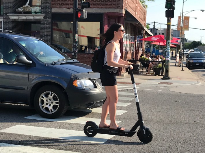 Riding a Bird scooter on Milwaukee Avenue in River North. Photo: John Greenfield
