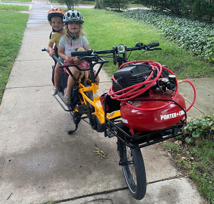 Margaret's electric cargo bike with her kids.