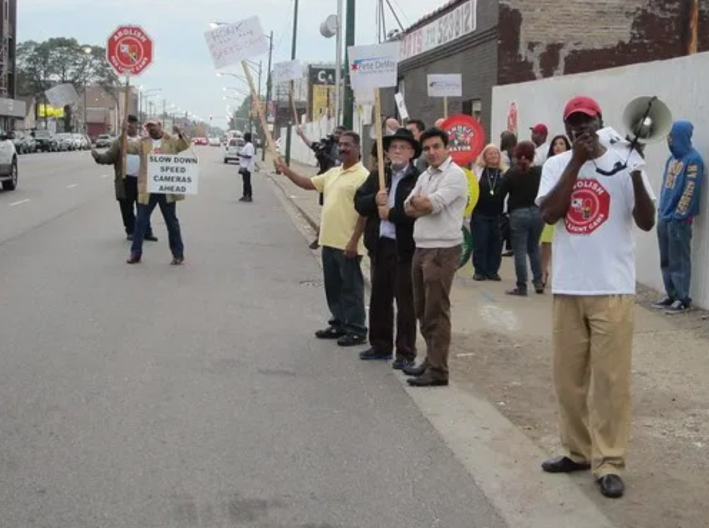 Anti-cam activists protest on Archer Avenue in 2014. Photo: John Greenfield
