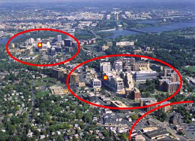 Aerial view of Rosslyn-Ballston corridor in Arlington, Virginia. High density, mixed use development is concentrated within ¼–½ mile from the Rosslyn, Court House and Clarendon Washington Metro stations (shown in red), with limited density outside that area. Image: Wikipedia