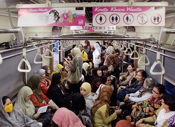 Indonesian women board a women-only carriage of a commuter train on the outskirt of Jakarta, Indonesia.Irwin Fedriansyah/AP
