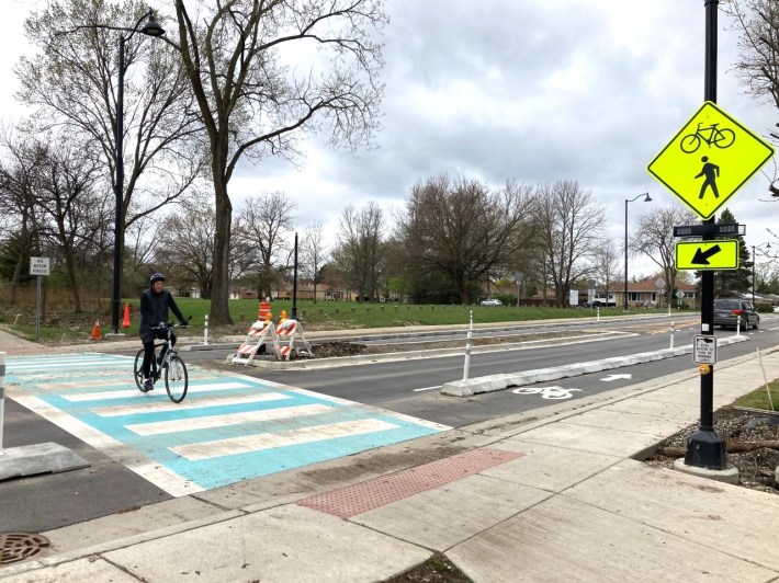 A new crosswalk with pedestrian-activated beacons for the North Branch Trail at Howard Street, where curb-protected bike lanes were recently installed. Photo: John Greenfield