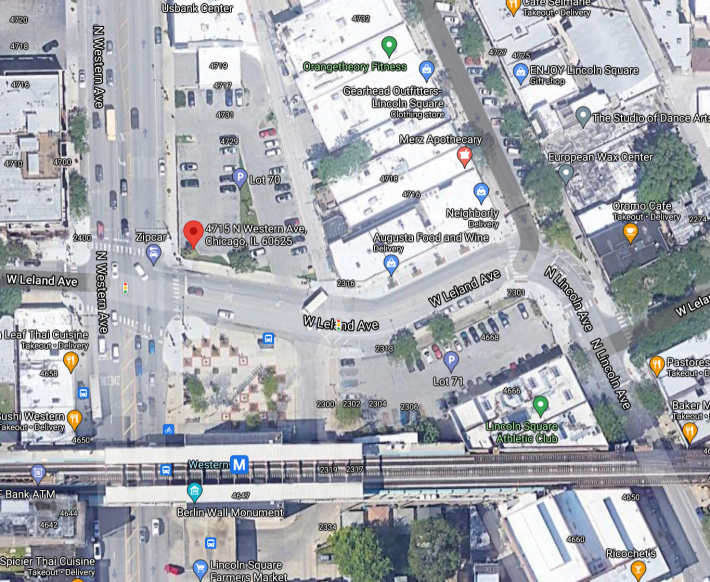 Aerial view of the proposed development location, marked with a red pin.