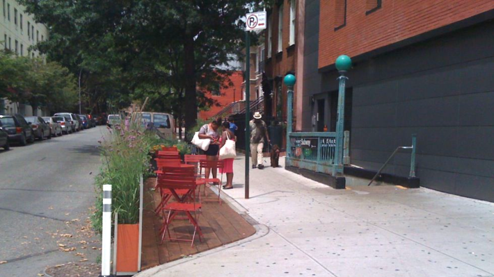 A curb extension with street furniture in New York City. Photo: NACTO