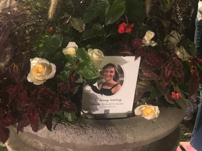 A photo of Sophie surrounded by flowers inside the memorial planter. Photo: Courtney Cobbs