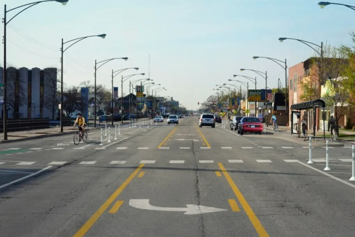 Rendering of Milwaukee Avenue with protected bike lanes, north of the Jefferson Park Transit Center. Image: CDOT