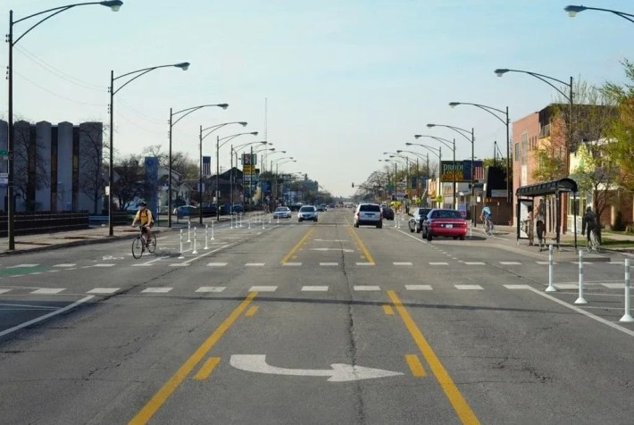 A redesign of Milwaukee Avenue with protected bike lanes, north of the Jefferson Park Transit Center, proposed by CDOT. Image: CDOT