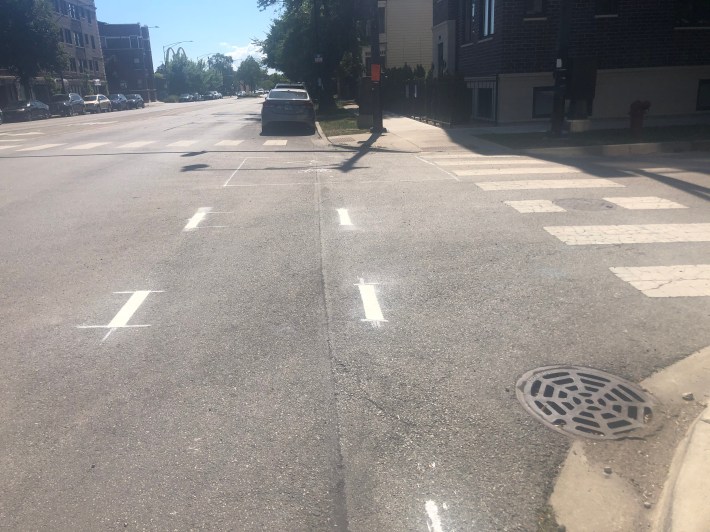 Markings along Clark St. southbound approaching Hollywood. It's barely visible but it looks like a bike box will be added to direct cyclists to Clark St. where dashed bike lanes begin.
