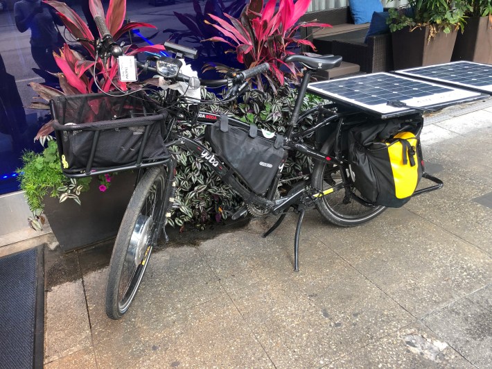 Sushil's solar-powered e-bike. The batteries for the bike are inside the triangle-shaped bag in the middle. Photo: Courtney Cobbs