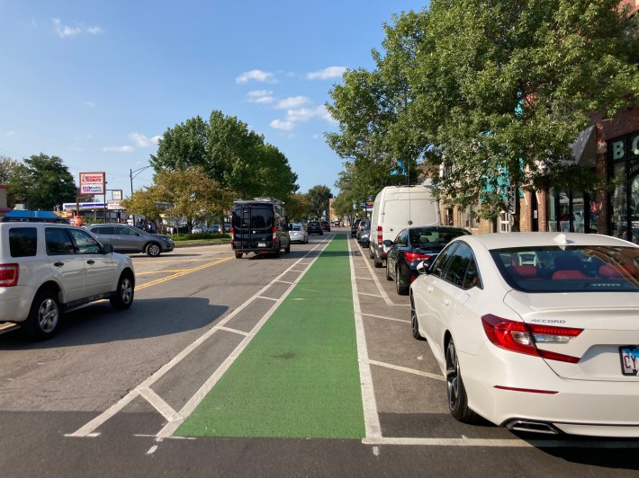 This stretch has wide buffers, so why wasn't the bike lane located next to the curb as a parking-protected bikeway? Photo: John Greenfield