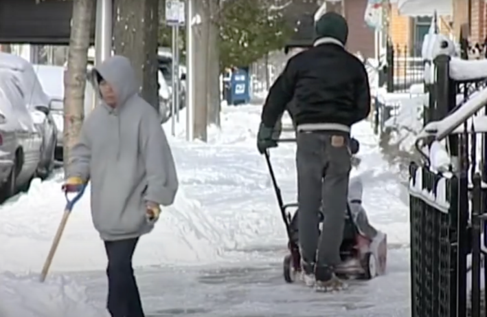 Residents clearing a sidewalk. Image: City of Chicago