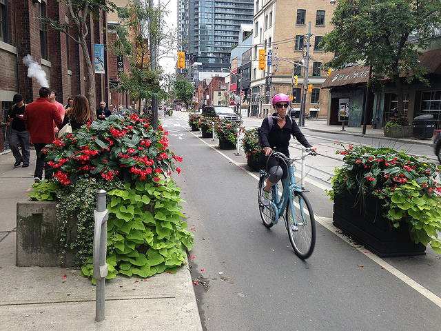 A flower box-protected bike lane in Toronto. Photo: John Greenfield