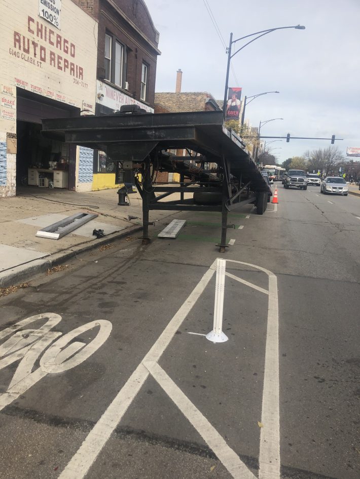 This was one of the most outrageous bike lane blockages I've encountered.Notice a Chicago Police officer drive by in the farmost right lane. Photo: Courtney Cobbs