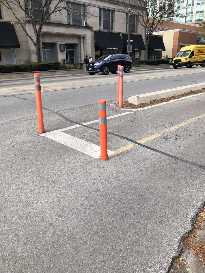 Plastic posts at the entrance of a protected bike lane at the intersection of Davis St & Chicago Avenue in Evanston.Photo: Courtney Cobbs