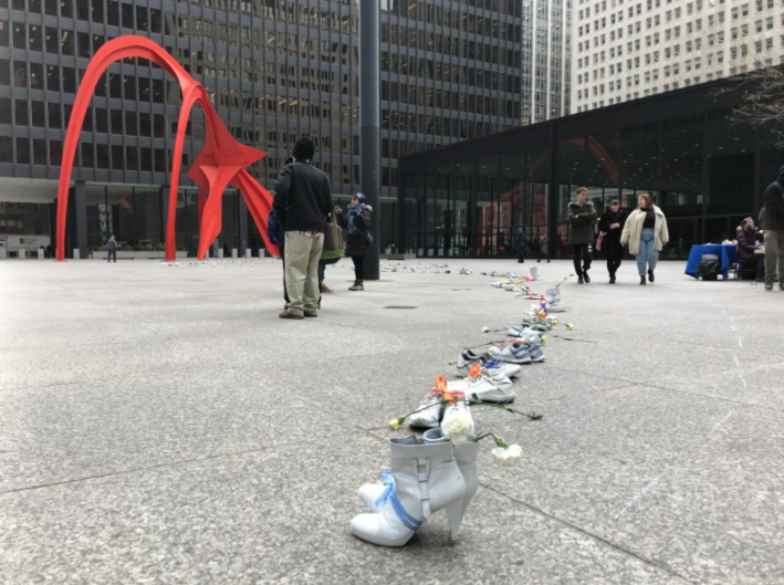 132 pairs of white-painted shoes in Federal Plaza during the 2018 memorial event. Photo: John Greenfield
