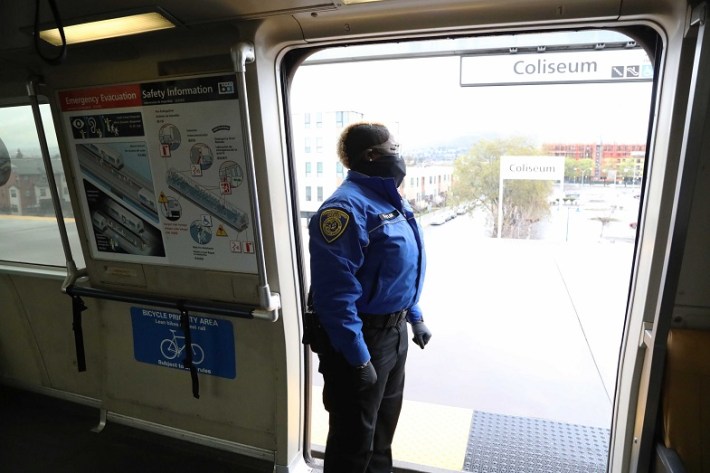 A BART Transit Ambassador checks the platform during a stop at Coliseum Station in Oakland. Photo: BART