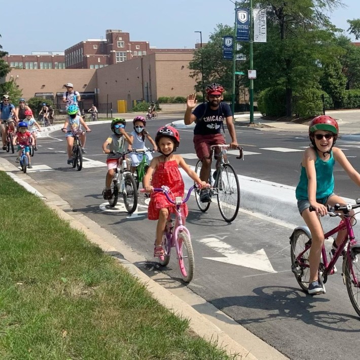 Roscoe Village Kidical Mass rides in the concrete curb-protected bike lanes installed on Campbell Avenue this summer. Photo: Rebecca Resman