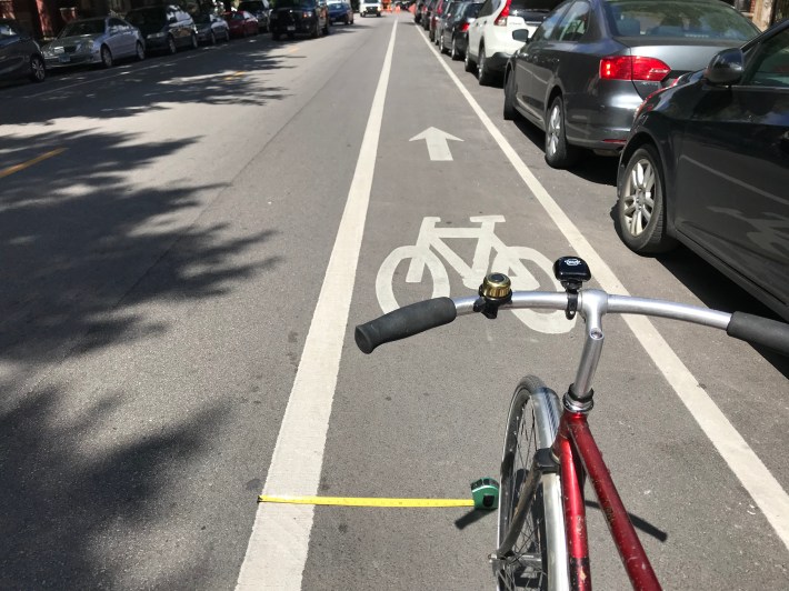 Ride a foot or two from the left line of a "door zone" bike lane at a moderate pace, and you're very unlikely to get doored. Photo: John Greenfield