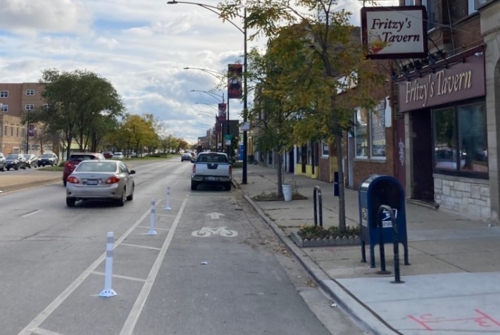 Protected bike lanes on Clark in Edgewater have been fairly useless due to illegal parking. Photo: John Greenfield