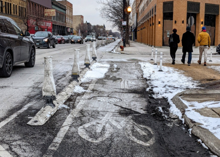 A plastic curb-protected bike lane on Milwaukee Avenue in Logan Square. Photo: Ruth Rosa