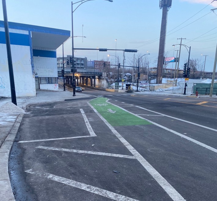 The location where northbound cyclists riding on the sidewalk will reenter the on-street bike lanes, just south of the river, looking south. Since there's no eastbound cross street, "right-hook" crashes won't be an issue. Photo: Twitter user @babygluckling