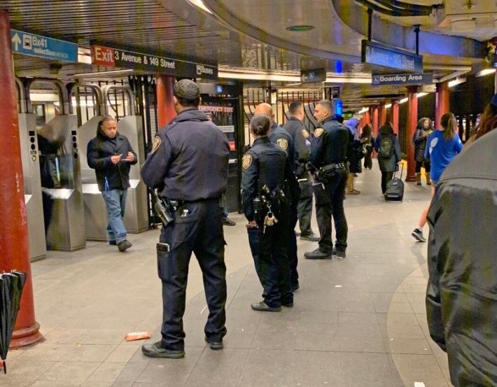 Police on the NYC subway during a 2020 fare evasion crackdown.