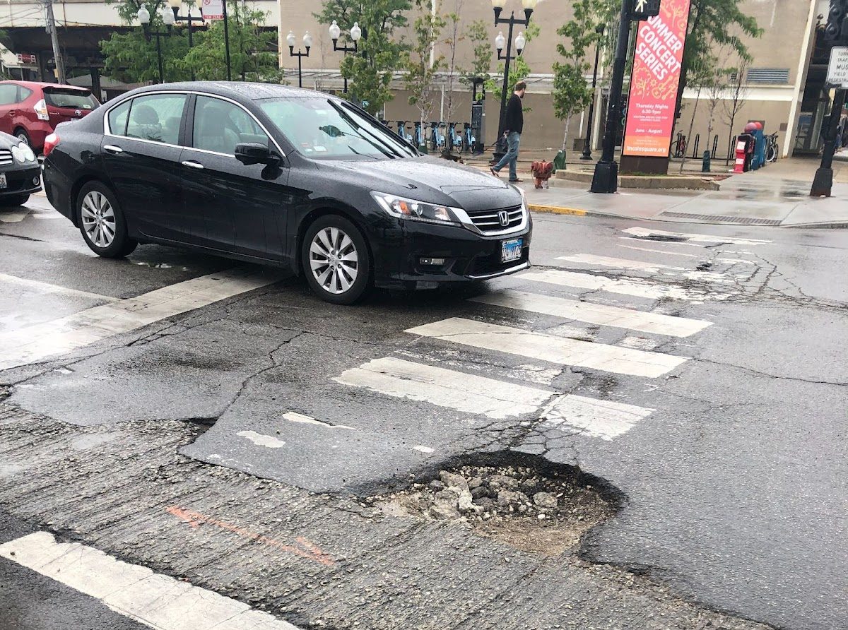 Looking southeast at Leland and Western around the time of the crash in 2019. The pothole is in the center of the image, and the Divvy station is visible at the top of the image. Image provided by Erron Fisher.