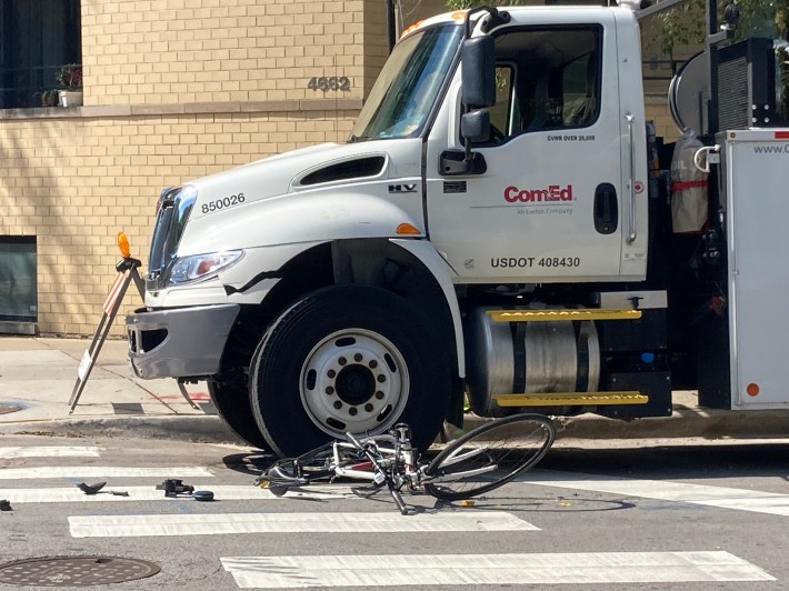 The mother's bicycle under the ComEd truck. Photo: John Greenfield
