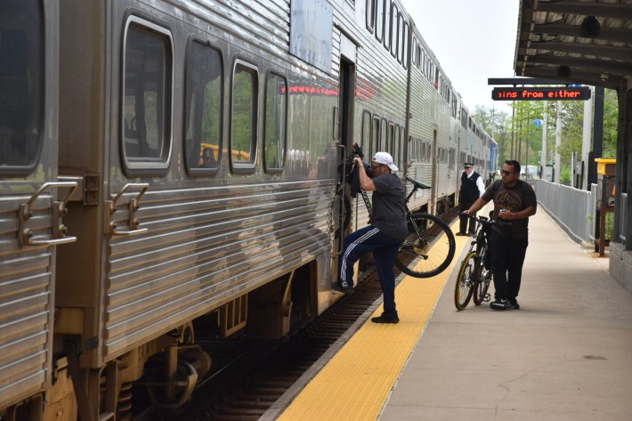A Metra passenger loading their bike on train as another waits to do the same.Photo: Audrey Wennink