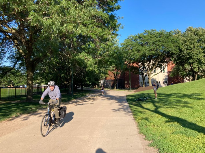 A senior rides on the multiuse path through the south end of Oz Park. Photo: John Greenfield