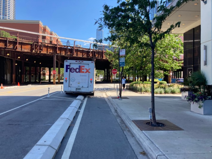 A FedEx truck partially blocking the eastbound lane at Kinzie/Clinton. Photo: John Greenfield