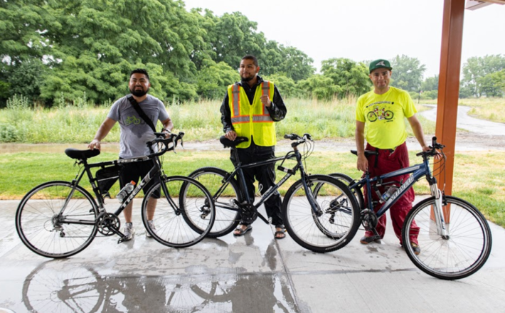 On June 25th, Jack and Alex led a bike ride during a rainy day from the East Side neighborhood, passing by the 100th St River Project site before heading south to Big Marsh Park. Left to right: Jack, Luis Cabrales from Southeast Youth Alliance, and Alex at the Big Marsh Bike Convergence. Photo: Alex Perez