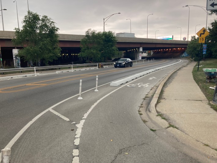 Eastbound curb-protected bike lane on Logan west of the viaduct, looking east. Photo: CDOT