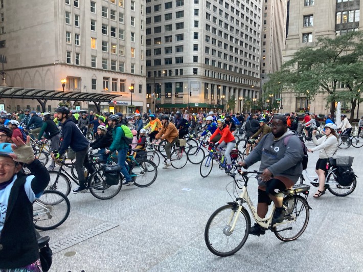 Riders circle the statue before departure. Photo: John Greenfield