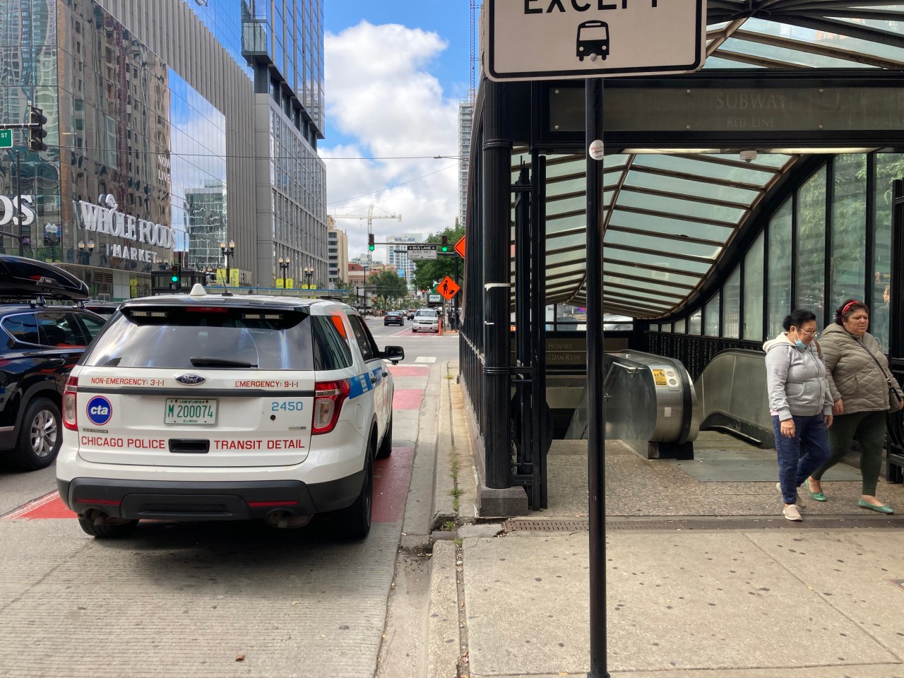 A Chicago Police transit detail vehicle parked in a bus lane by the Chicago Avenue Red Line entrance, during non-bus lane hours. Photo: John Greenfield