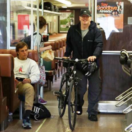 Earnshaw bringing a bike on a South Shore Line train.