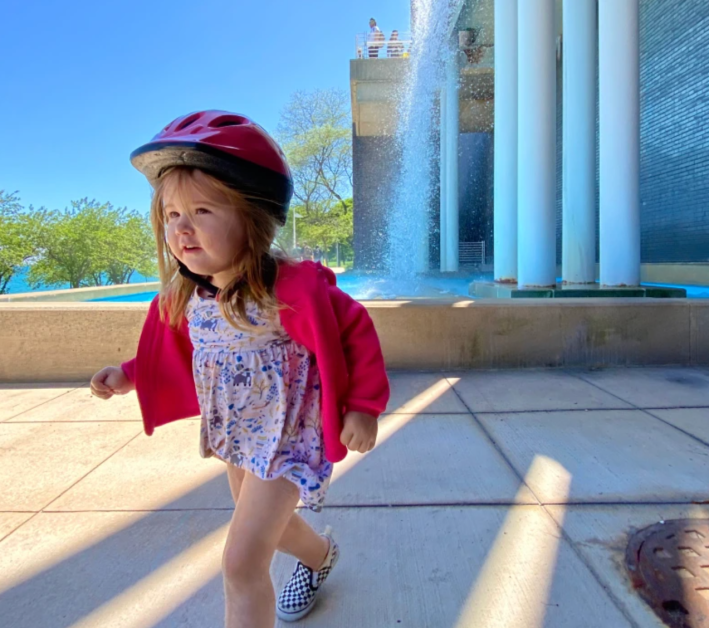 Lily Grace Shambrook by a fountain at McCormick Place during a bike ride on the Lakefront Trail. Photo: Provided