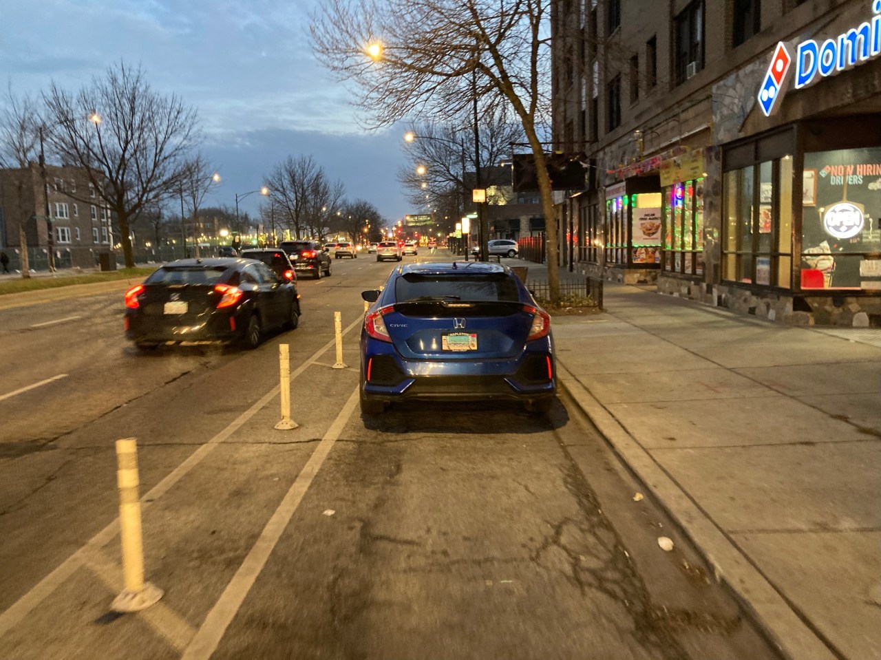 A car parked in a flexi-post delineated bike lane on Clark this evening. Photo: John Greenfield