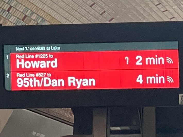 The candy cane icon on this platform screen indicates that the next run is the Holiday Train. Photo by a reader.