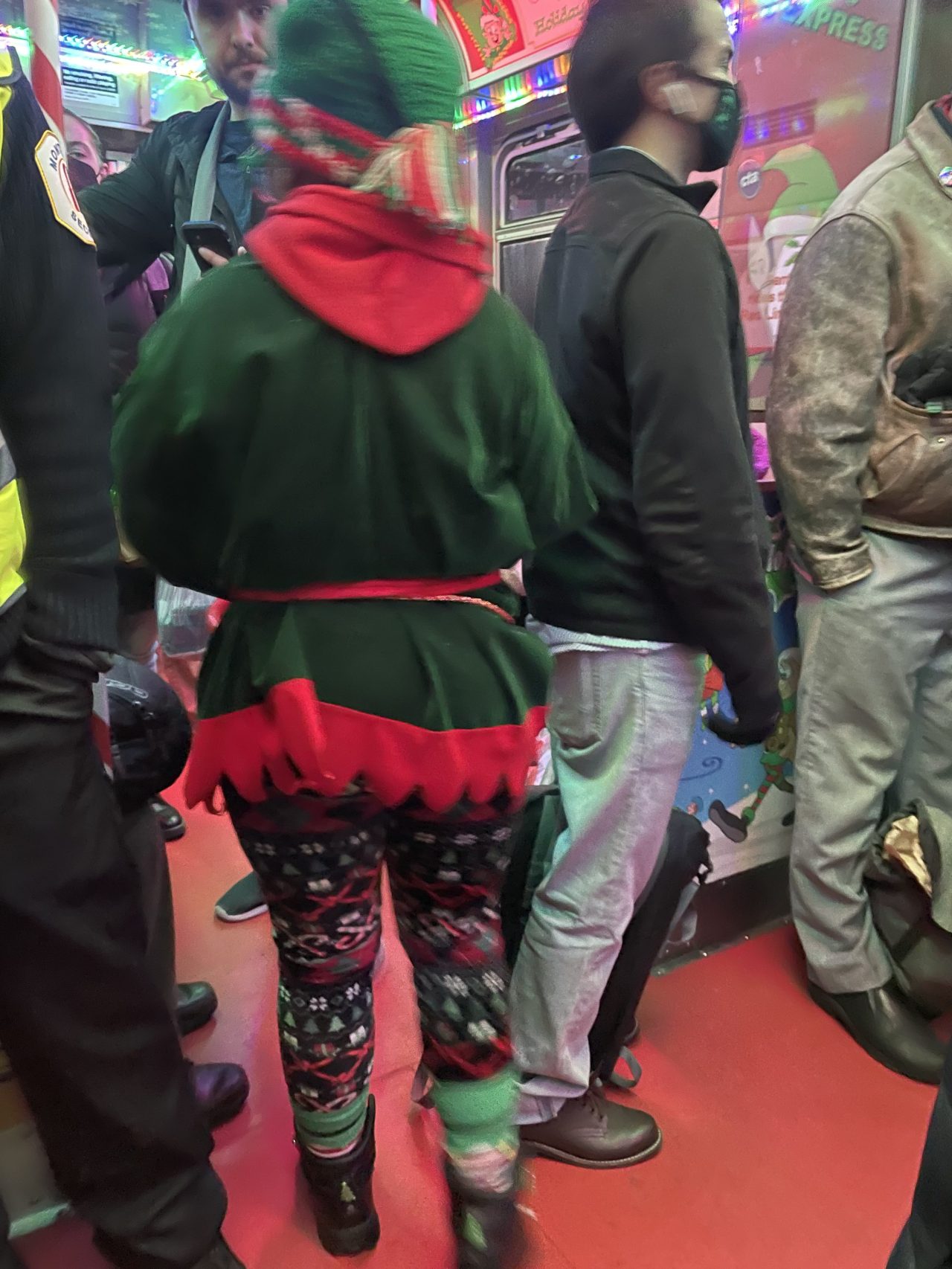 An elf gives out candy canes on the Holiday Train. Photo by a reader.
