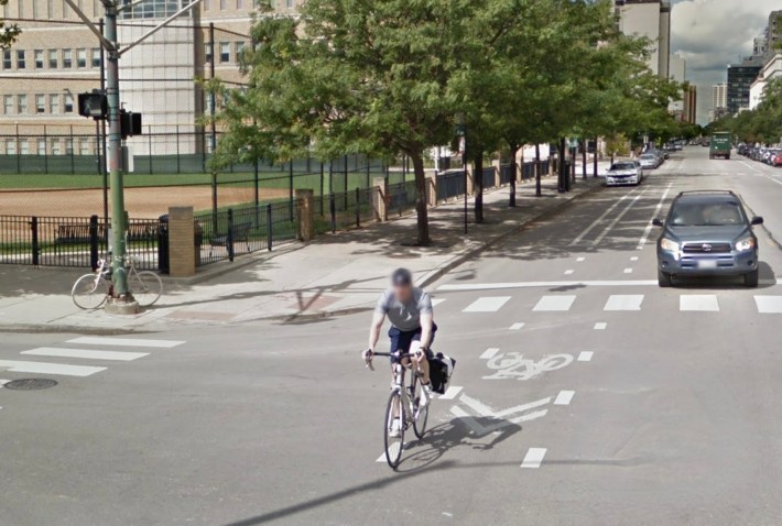 Ghost bike memorial for Neill Townshend at the northwest corner of Oak and Wells streets, and the non-protected "door zone" bike lanes on Wells. Image: Google maps