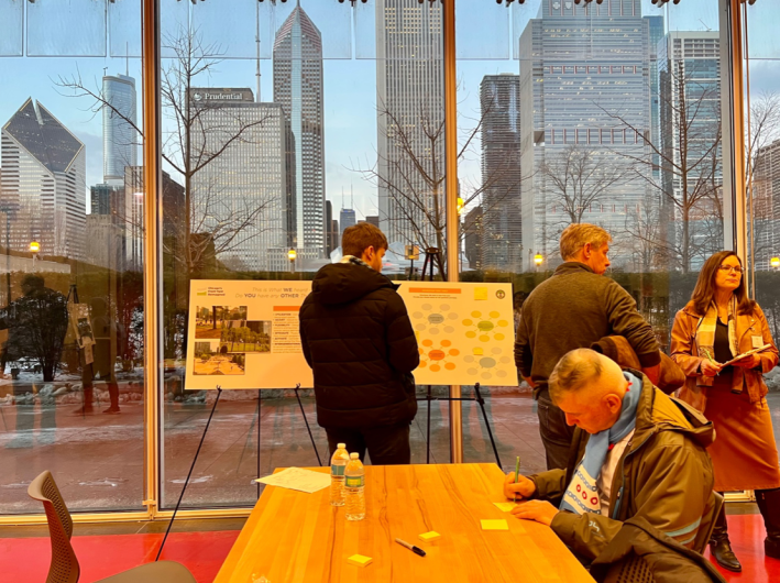 Attendees leave comments on the Recreation board; Project Manager Kari Berg from UrbanWorks) take notes. Photo: Olivia Grenzebach