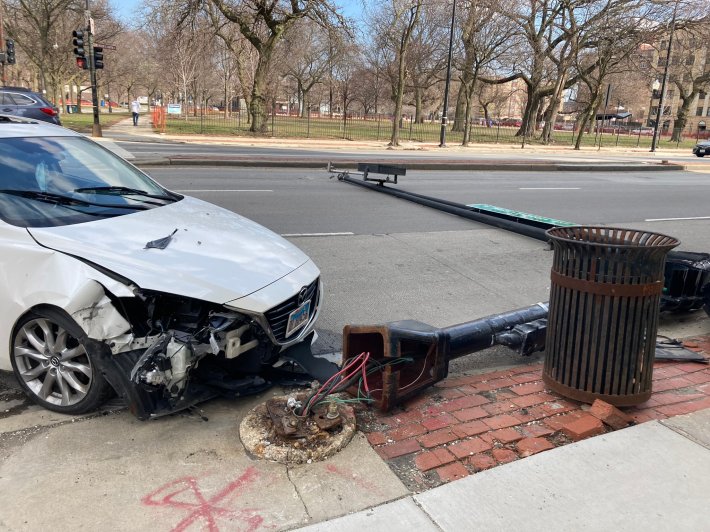 A likely driver took out a light pole yesterday at Washington/Ashland, next to Union Park. Photo from a reader.